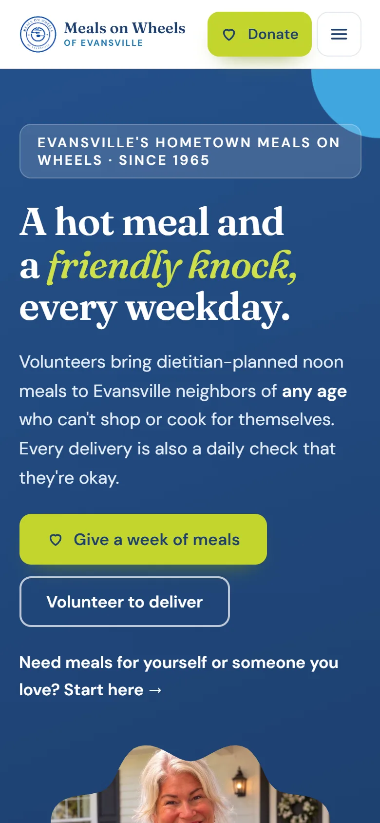 The same homepage on a phone, with full-width buttons and the menu tucked behind a button.